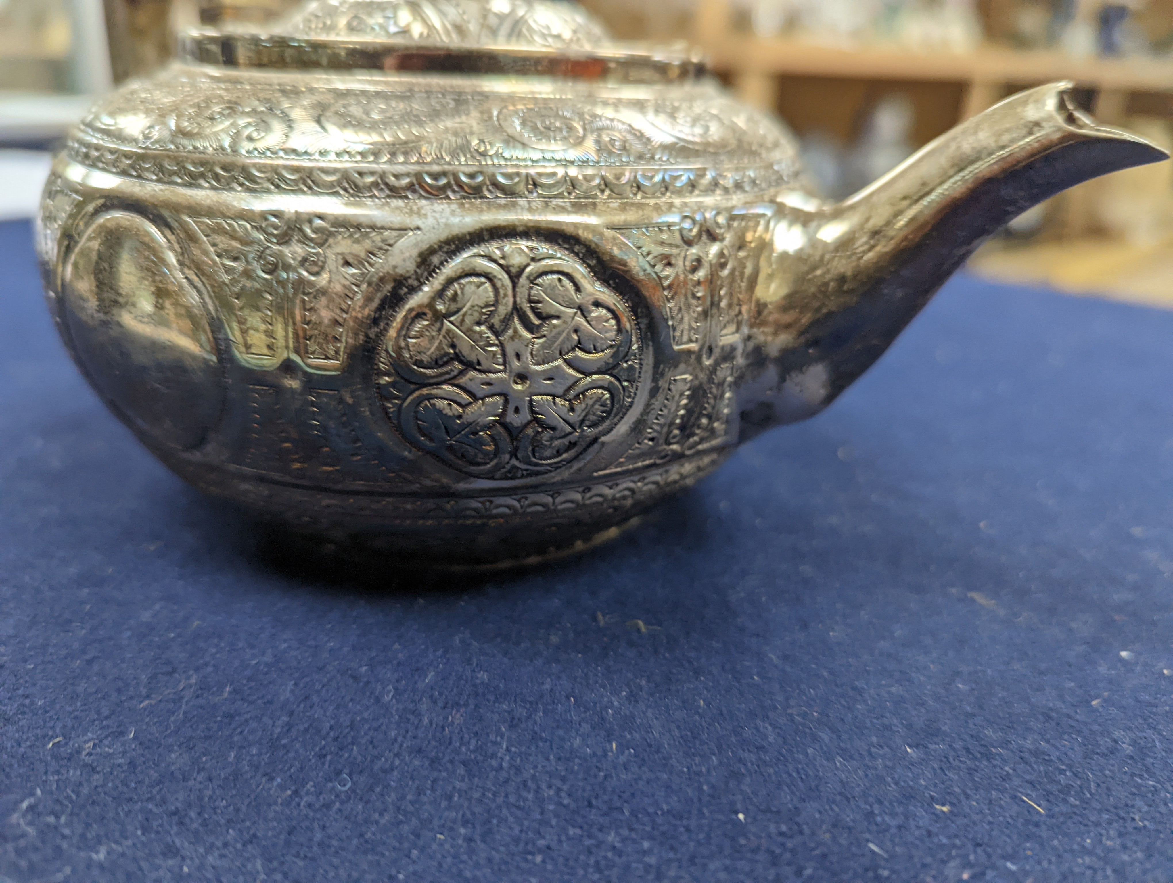 A WMF dish, Islamic white metal mounted photo album and a plated teapot and jug